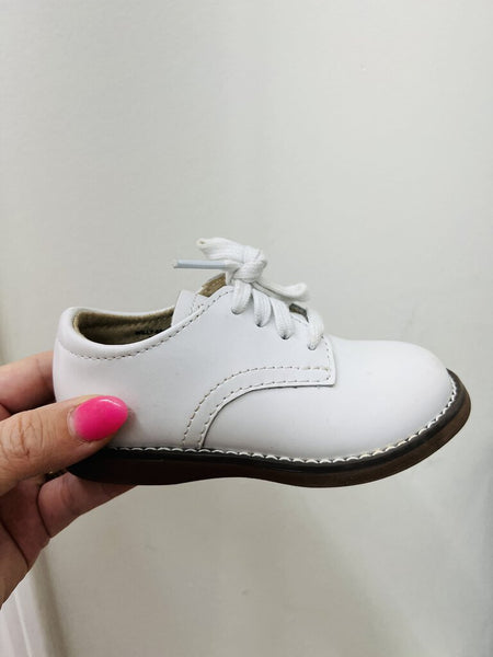 White hard bottom walking shoe